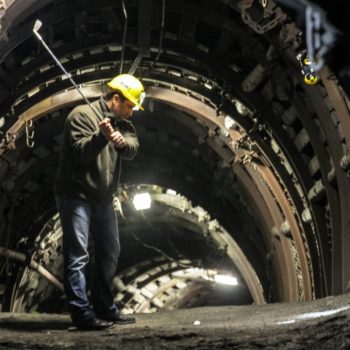 A miner plays golf inside the historic coal mine "Guido", Poland, EU.