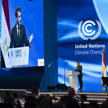 The photo was taken at the 27th Conference of Parties of the UNFCCC in Sharm El Sheikh, Egypt. In this photo, French President Emmanuel Macron announced that France will host an international Summit for a New Global Financing Pact in June 2023.