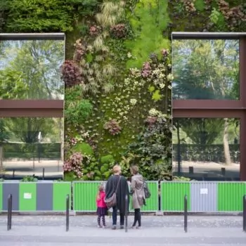 Visitors admire the green wall and sustainable architecture at the Musée du Quai Branly, Paris. Image via RENE SPITZ - Energy Performance of Buildings Directive