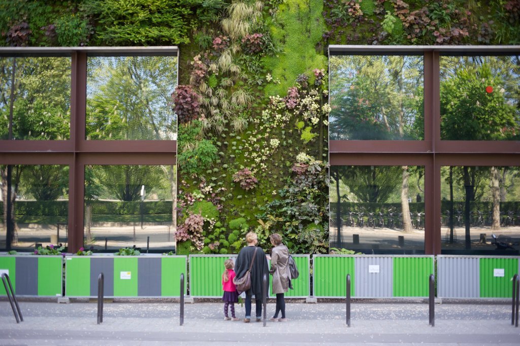 Visitors admire the green wall and sustainable architecture at the Musée du Quai Branly, Paris. Image via RENE SPITZ - Energy Performance of Buildings Directive