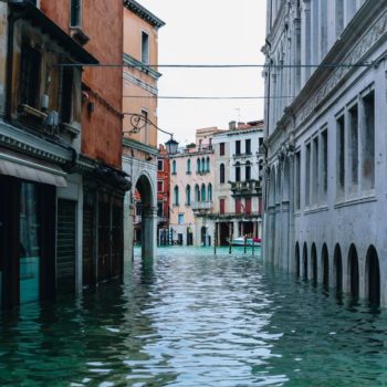 A canal in Venice, Italy. Photo by Nastya Dulhiier on Unsplash.