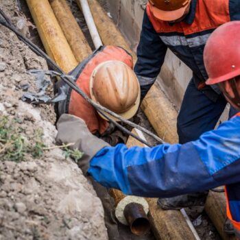 A group of workers work on old gas pipes. REPowerEU aims to halve the EU’s gas consumption by 2030 compared to 2019, which would almost align the bloc’s trajectory with a climate neutral pathway.
