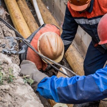 A group of workers work on old gas pipes. REPowerEU aims to halve the EU’s gas consumption by 2030 compared to 2019, which would almost align the bloc’s trajectory with a climate neutral pathway.