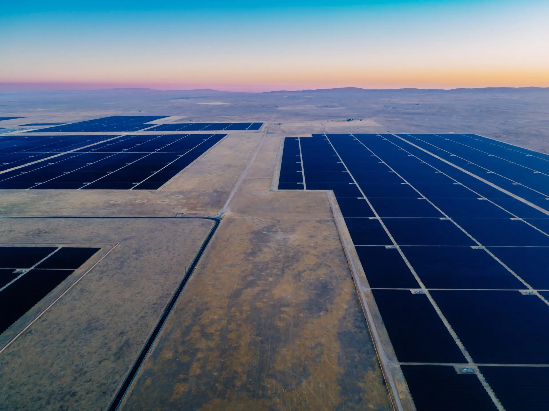 Aerial view of a vast solar panel farm in Santa Margarita, California, USA, harnessing renewable energy from the sun to power homes and businesses.