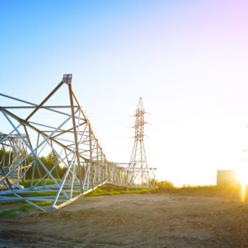 Electric tower construction. Transmission Lines Tower Erection. High voltage electricity pylons, Electrical Transmission Tower repair. Electric towers installation. Power line towers construction.