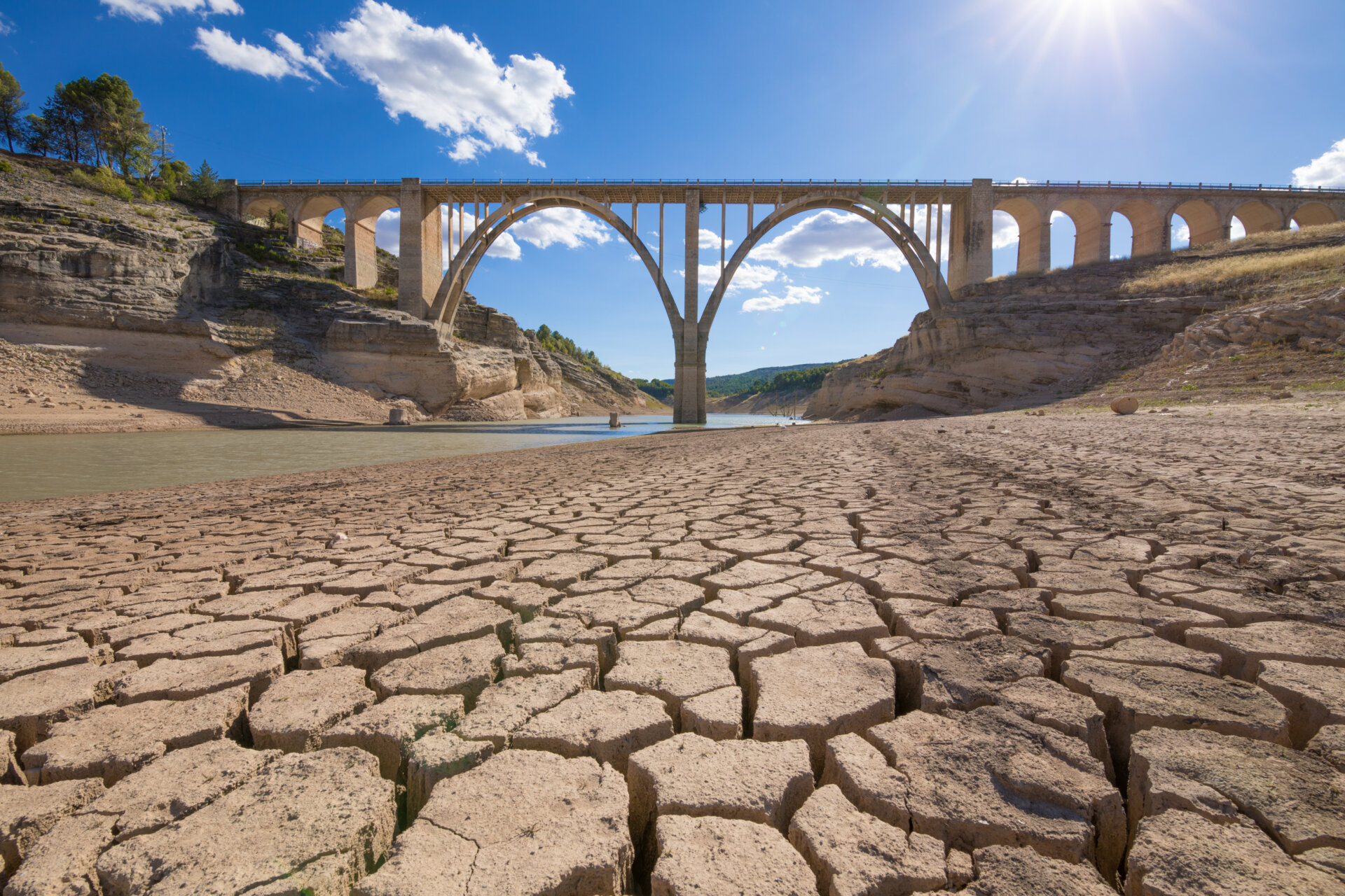 drought in spanish reservoir with viaduct