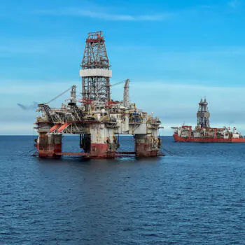 Offshore oil and gas drilling platform, Semi-submersible oil rig, offshore extraction platform and drillship operating in the open ocean during deepwater exploration. Global energy market instability
