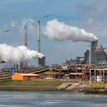 Factory Tata Steel with smoking chimneys on a sunny day, IJmuiden, The  Netherlands Stock Photo