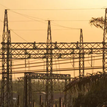 Silhouette of electrical power lines during a golden sunset in South Kalimantan, Indonesia