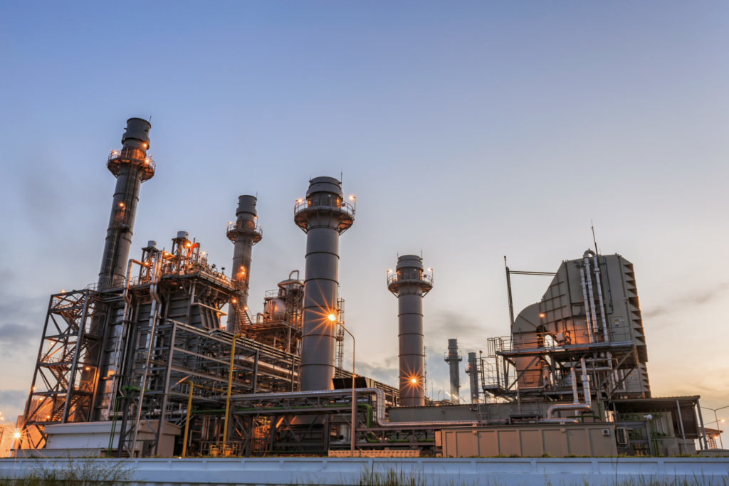 Gas turbine electrical power plant at dusk with twilight sky