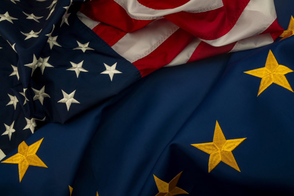 TTIP, USA and EU cooperation and Transatlantic Trade and Investment Partnership concept theme with the flags of the United states of America and the European Union