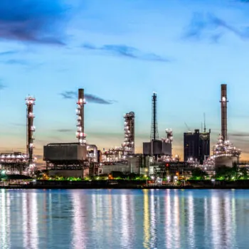 Oil and gas refinery industry plant with glitter lighting and sunrise in the morning, Factory of petroleum industrial, Power plant,Energy power station area. Industry 4.0