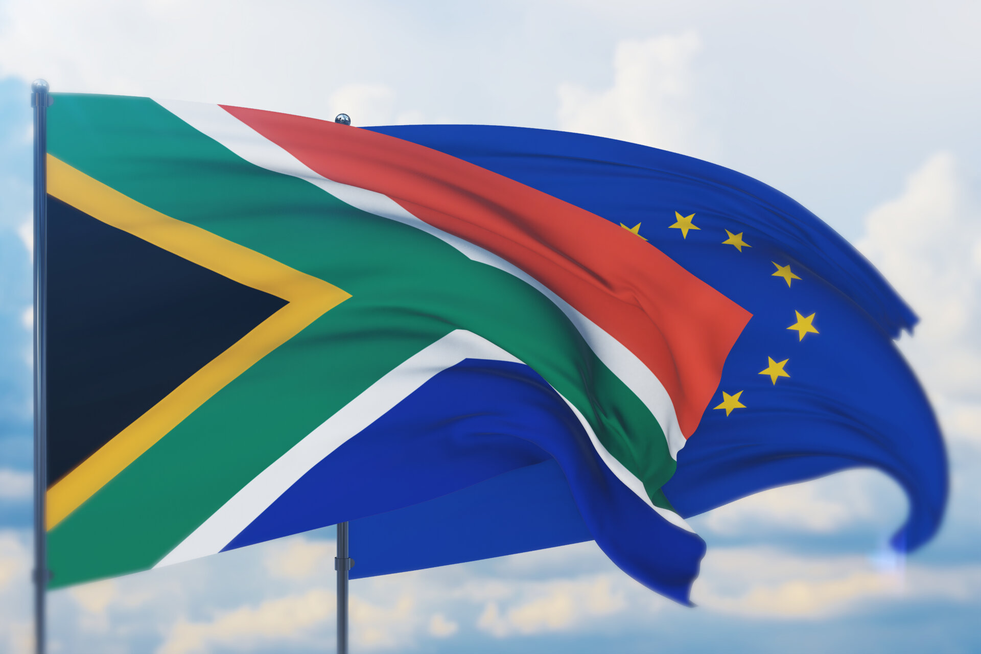 Waving European Union flag and flag of South Africa.