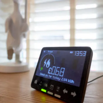 Shallow focus of a dusty digital smart meter showing the amount of used electricity. Seen in the living room of a private house.