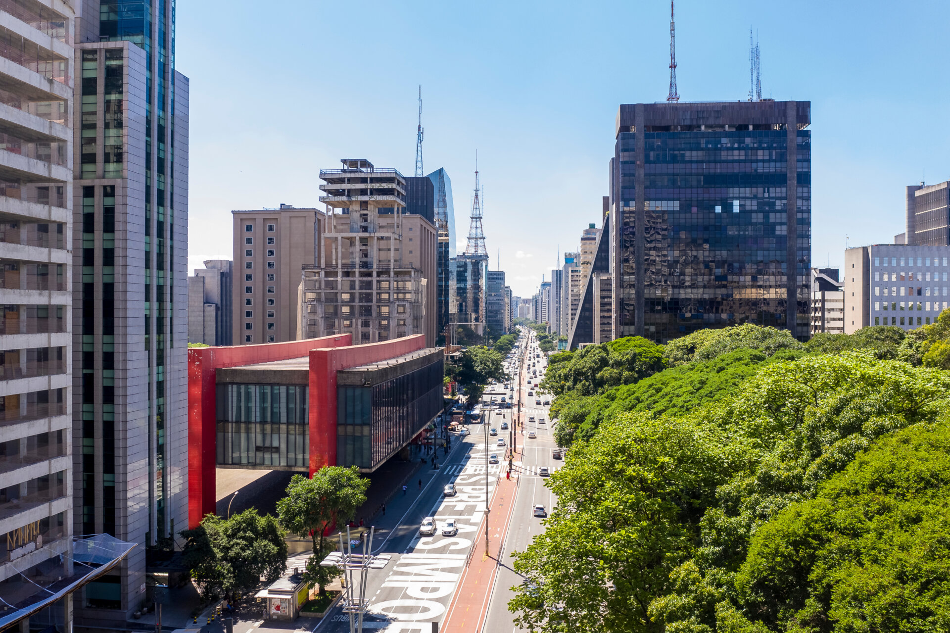 Paulista avenue, financial center of Sao Paulo and Brazil and MASP seen from above with its commercial buildings and intense movement of people and cars