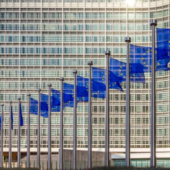 Row of EU Flags in front of the European Union Commission buildi