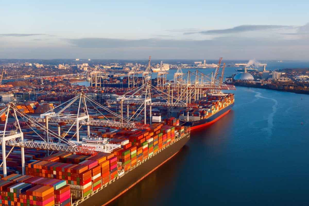 Aerial view of colorful containers on cargo ships at the port of