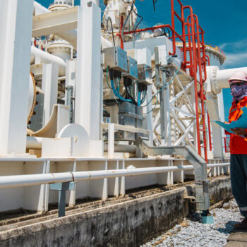 Male worker inspection at steel long pipes and pipe elbow in sta