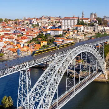 Porto Portugal with bridge Ponte Dom Luis I Douro river with tram town travel