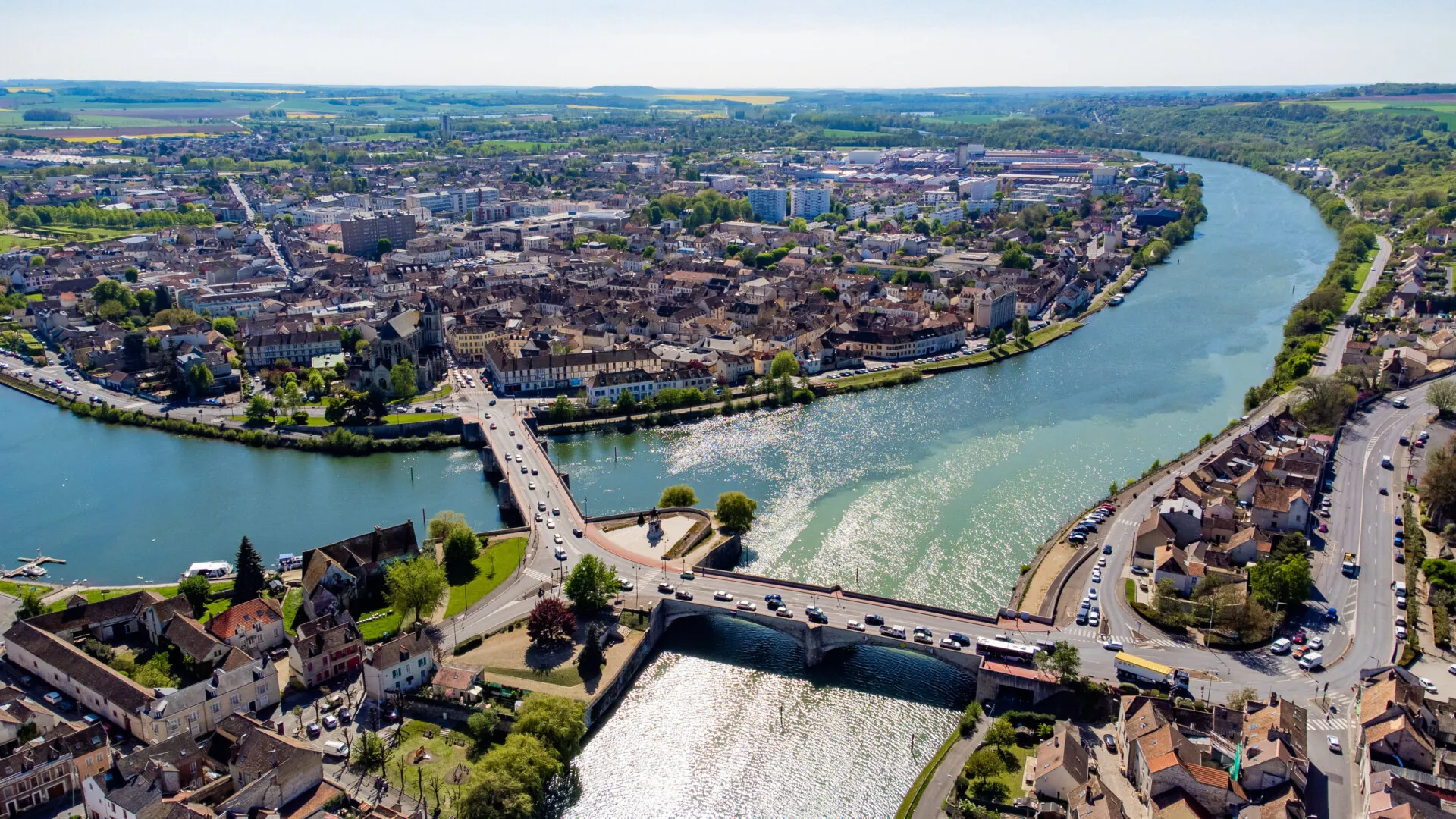 Aerial view of the confluence between the Seine and the Yonne showing different colors of water mixing in the town of Montereau Fault Yonne in Seine et Marne, France