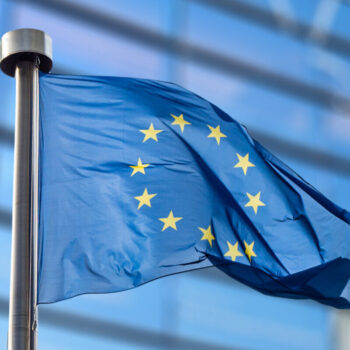 European Union flag against European Parliament