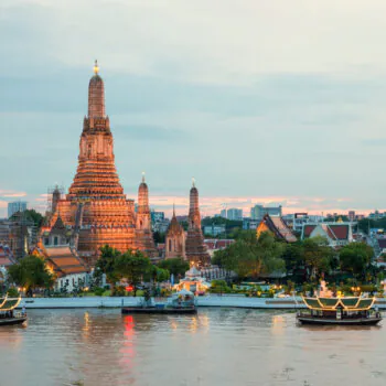 Wat Arun and cruise ship in night ,Bangkok city ,Thailand
