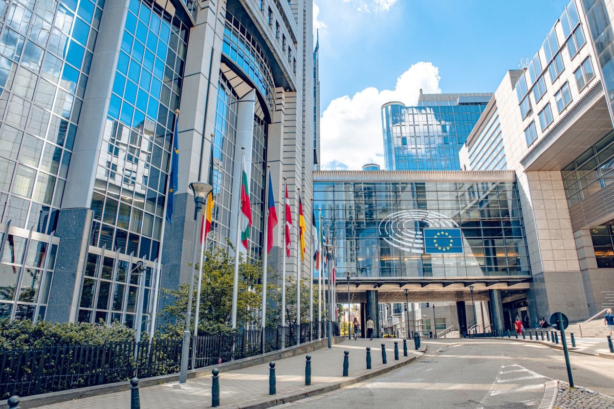 Brussels, Belgium July 20, 2020. European Parliament offices and European flags. Photo via Adobe.