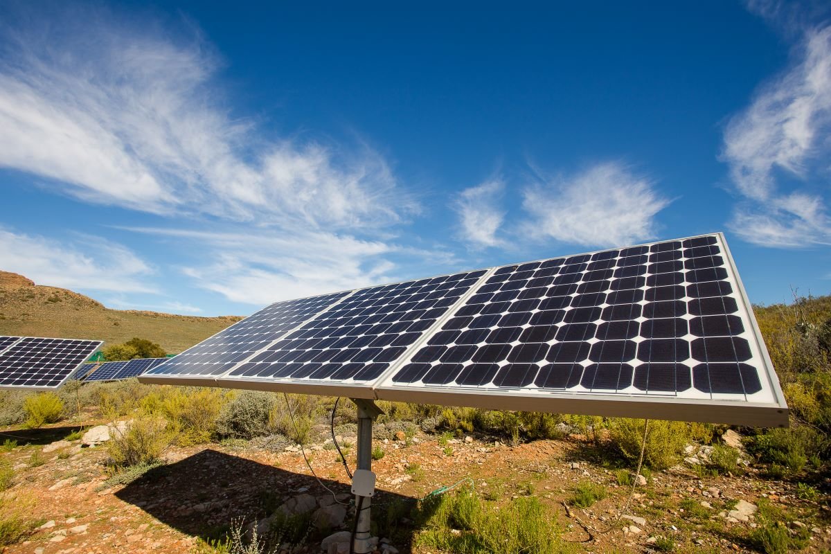 Close up wide angle view of photovoltaic solar panels on an off the grid electricity instalation on a farm in the Karoo outside Touwsrivier in the western cape of south africa