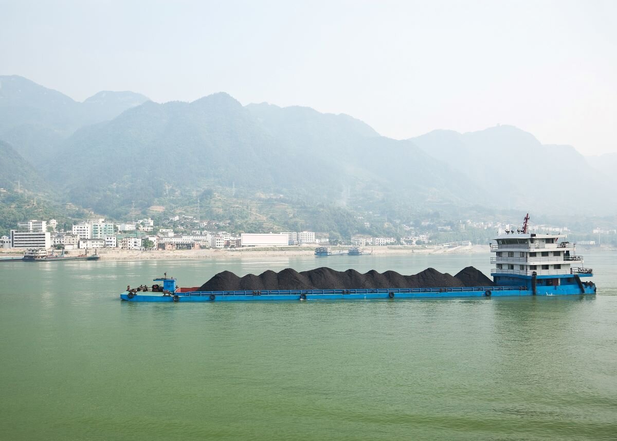 Coal barge sailing along the Yangtze river in China. Photo via Adobe