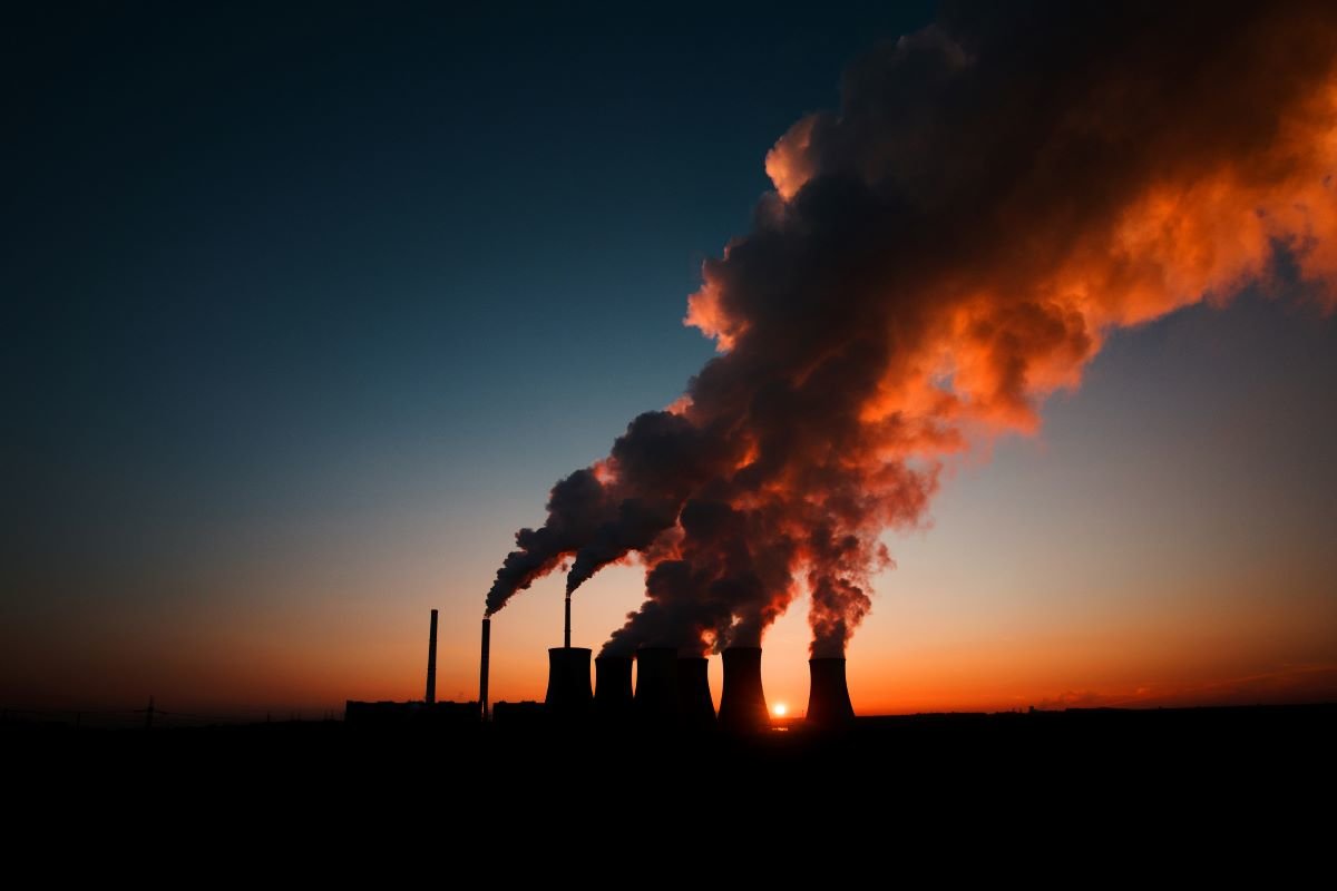 Coal fired power station silhouette at sunset, Pocerady, Czech republic, as COP26 consigns coal to history. Photo via Adobe.