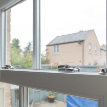 Detailed view of a newly installed, energy saving double glazed sash window. Energy efficiency measures like these are a key way to get the UK off Russian gas. Photo via Adobe