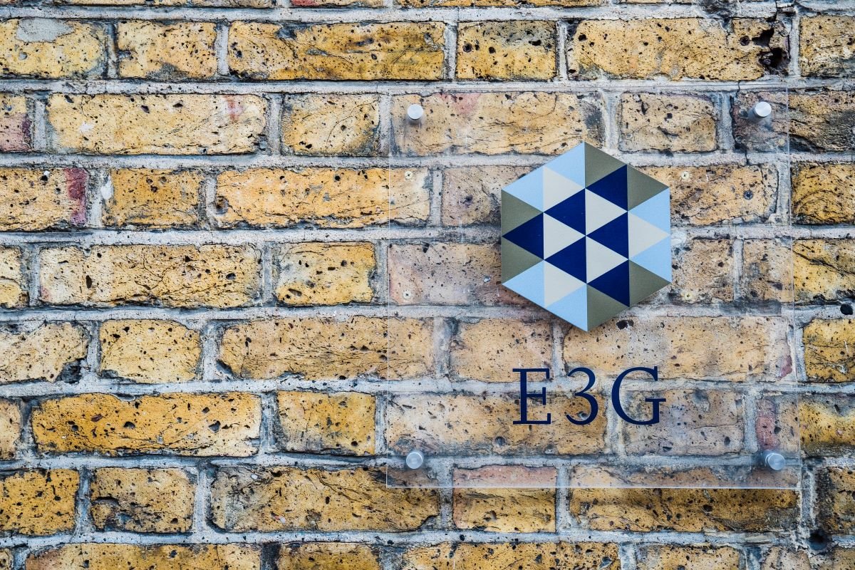 E3G logo against a brick wall in the E3G office