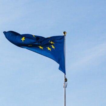 EU flag against blue sky