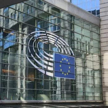 EU flag logo on the European Parliament 'Paul Henri-Spaak' building in Brussels, Belguim. Photo bu Guillaume Perigois via Unsplash.