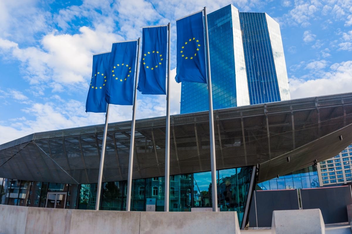 EU flags in Frankfurt, Germany, outside the new headquarters of the European Central Bank. Photo via Adobe Stock