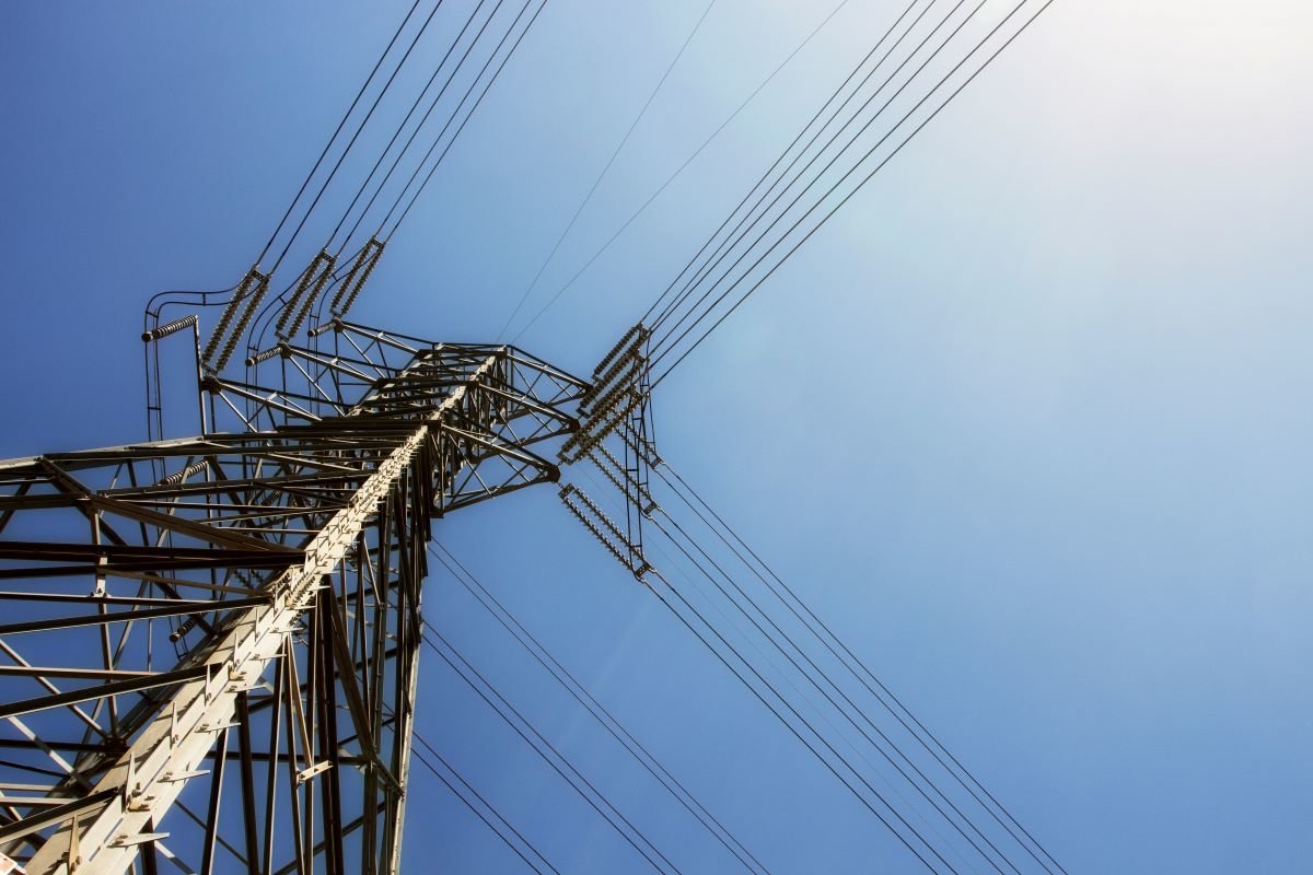 Electriticy wires against a blue sky