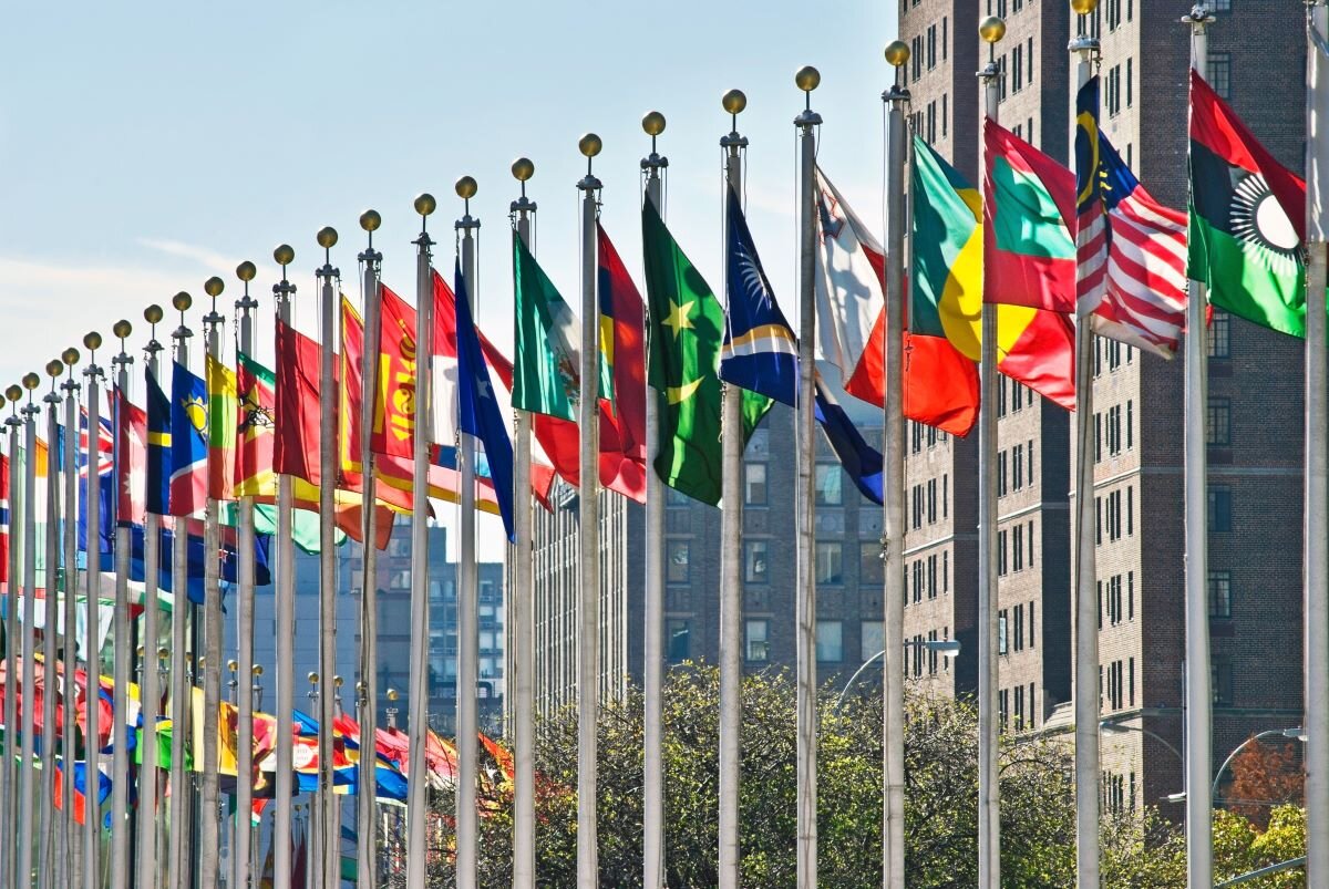Flags of all nations outside the UN in New York City. To fight climate change, democratic countries must find a way to work with autocratic ones.