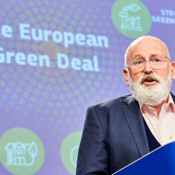 This image shows Frans Timmermans, European Commissioner for the European Green Deal with blue background where it's written "The European Green Deal".