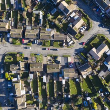 Aerial view of homes in suburban England. Decarbonising home heating is key for UK homes.