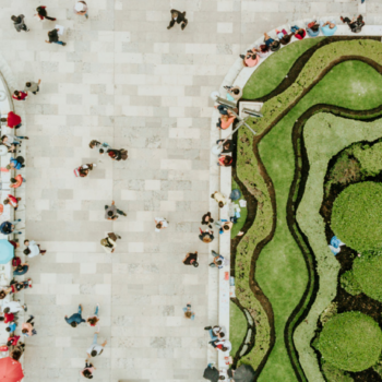 Aerial view of a public city pathway surrounded by greenery. Image courtesy Orbon Alija on iStock, SCHUMACHER Brand + Interaction Design GmbH, via GIZ.