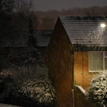 Landscape with an old house in the night in winter, Coventry, England, UK