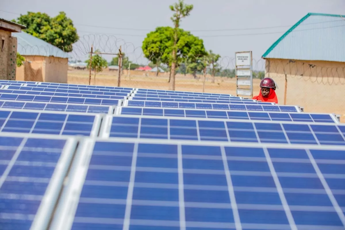 Off-grid, renewable energy technologies, like solar panels, are unlocking access to clean and sustainable energy across communities in Nigeria. Photo via Power Africa on flickr.