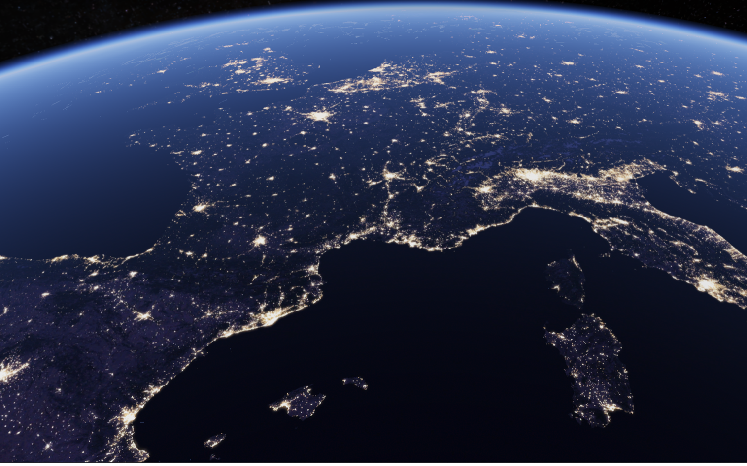 Satellite view of Europe at night, showing the light networks across the continent