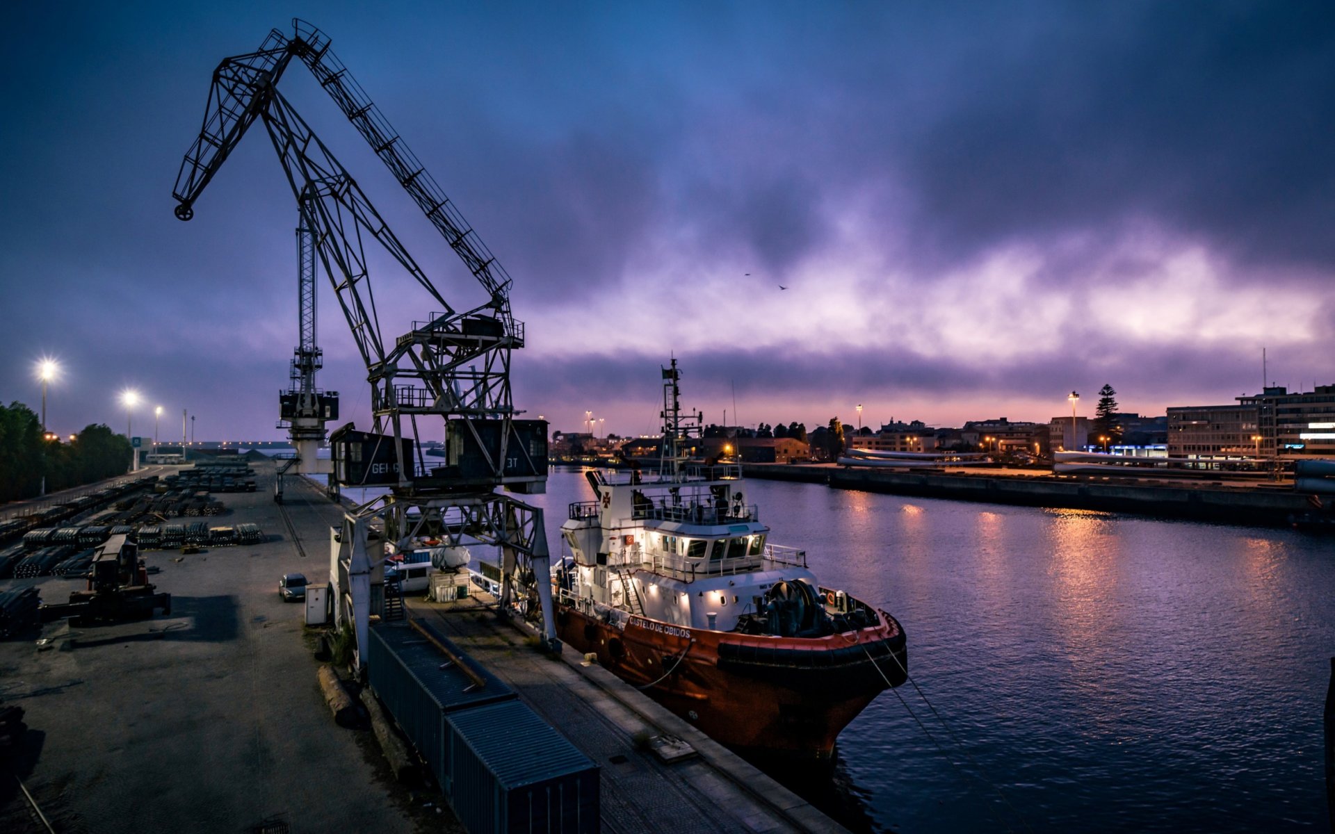 The image shows a cargo ship in the sea trade port of Matosinhos, Porto in Portugal