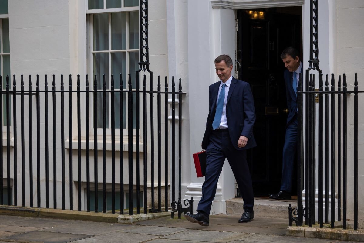 The Chancellor of the Exchequer Jeremy Hunt, accompanied by his ministerial team and watched by his wife and children, leaves 11 Downing Street on his way to deliver the budget. Picture by Simon Walker for No 10 Downing Street on flickr.