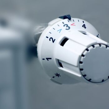Temperature valve turned down for a radiator powered by natural gas, Photo via Adobe