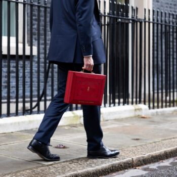 The Chancellor Jeremy Hunt walks outside Downing Street with the Budget box. By introducing fiscal support for energy efficiency in the Autumn Budget, the Treasury can pave the way for higher standards in the private rented sector. Photo by Zara Farrar for HM Treasury on flickr.