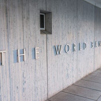 The World Bank Group sign outside building in Washington DC. Photo via Adobe.