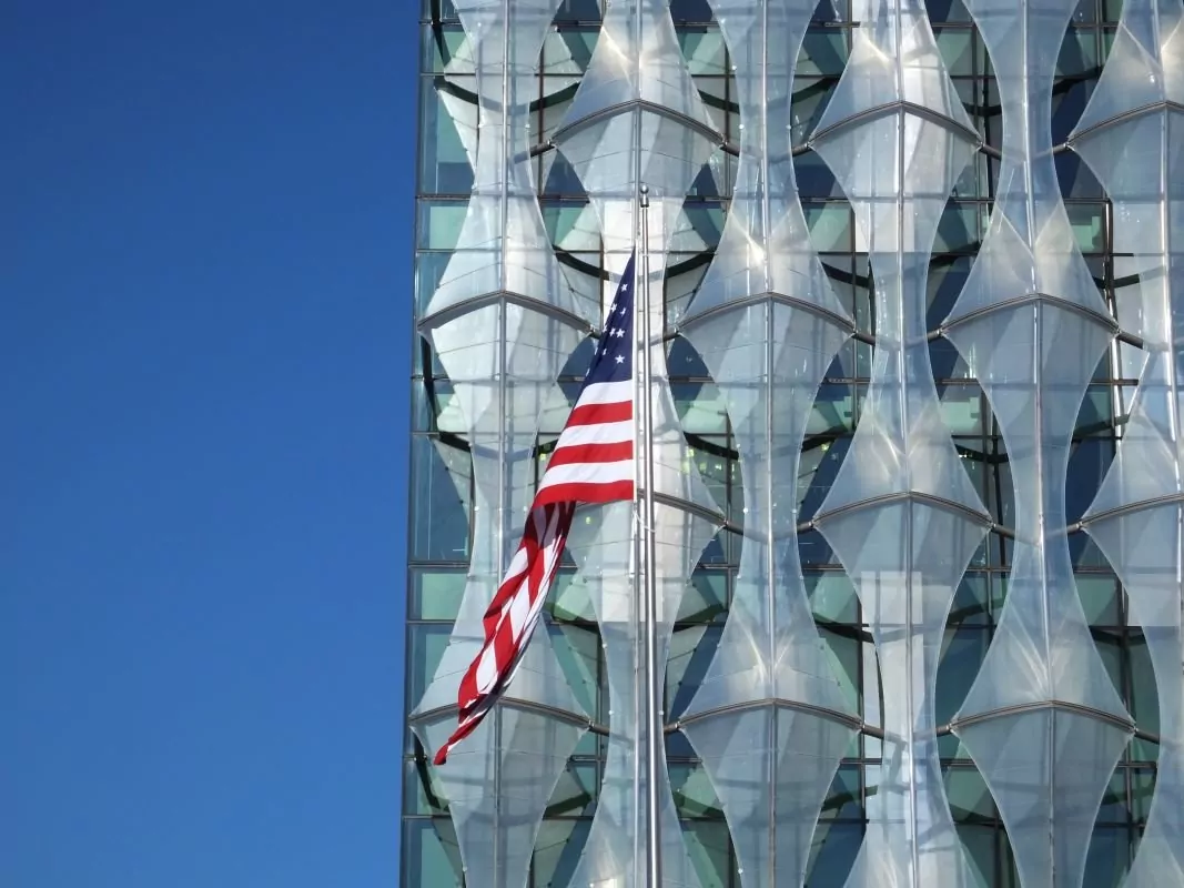 US flag outside embassy building