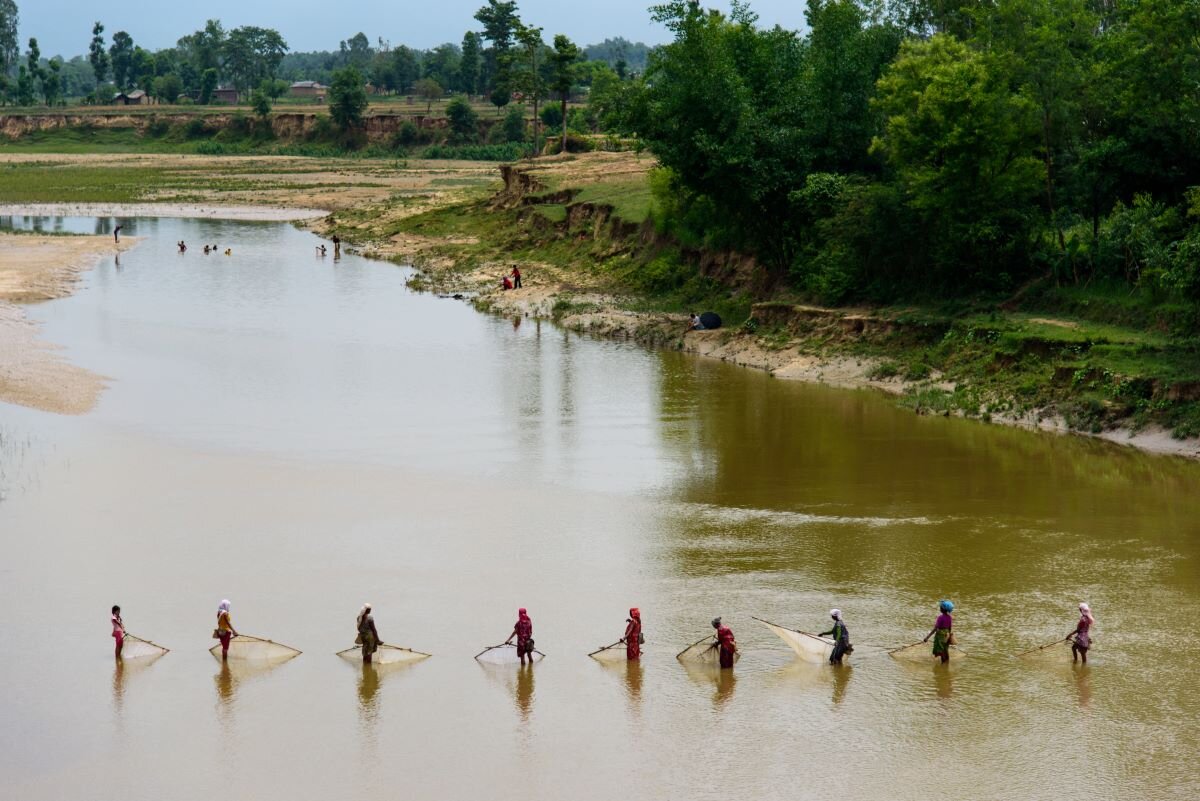 Women fishing in the Terai region of Nepal. Nepal is one of Eleven countries and institutes have endorsed the vision and will work together as a coalition to drive forward progress and report back at the 2024 Climate and Development Ministerial. Photo by Olaf Zerbock via Flickr.